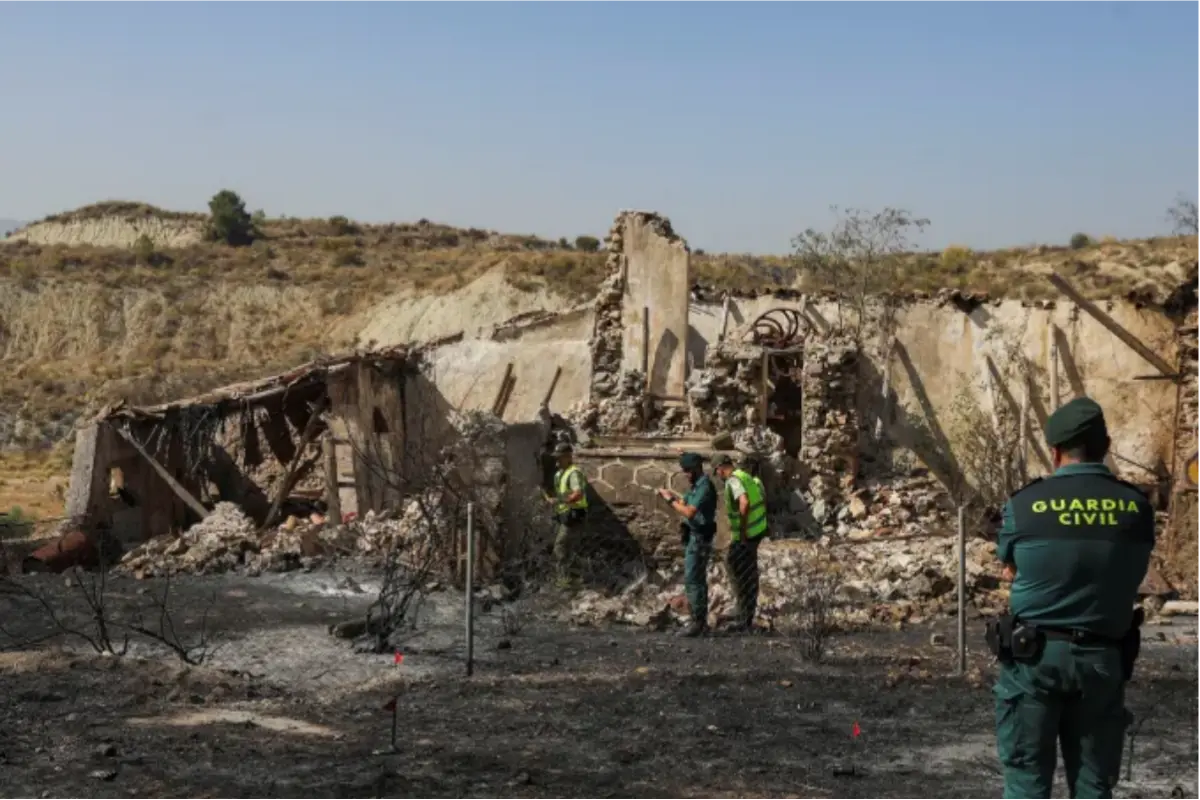 Members of the Spanish Guard conduct an investigation during a wildfire in Almocaizer, in the vicinity of Los Gallardos, Spain , on July 10, 2026. Photo: Loyola Perez de Villegas Muniz/Reuters