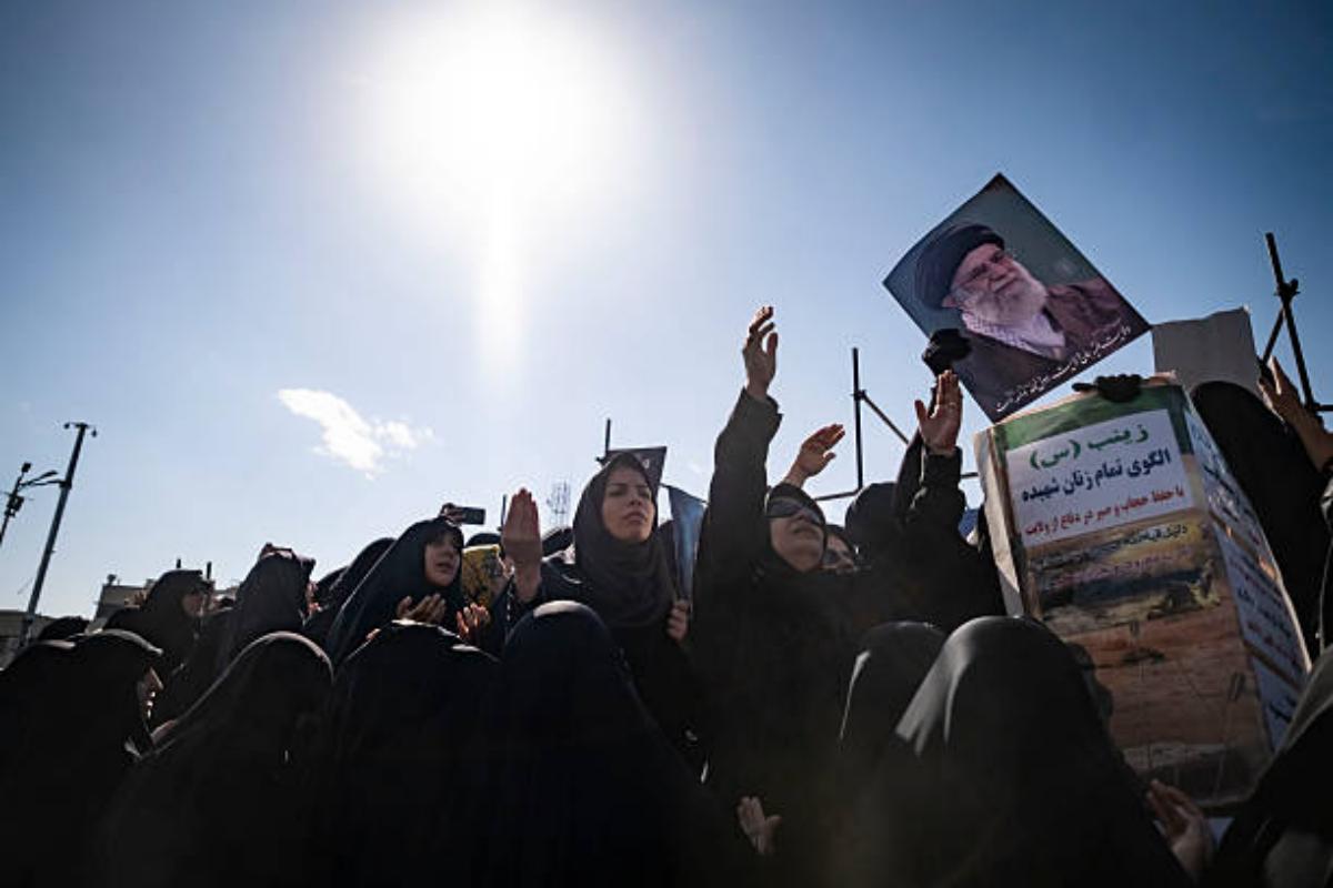 Veiled Iranian woman hold a portrait of Iran's Supreme Leader Ayatollah Ali Khamenei and mourn during a rally in Tehran on March 1, 2026. Photo: Morteza Nikoubazi/NurPhoto via Getty Images