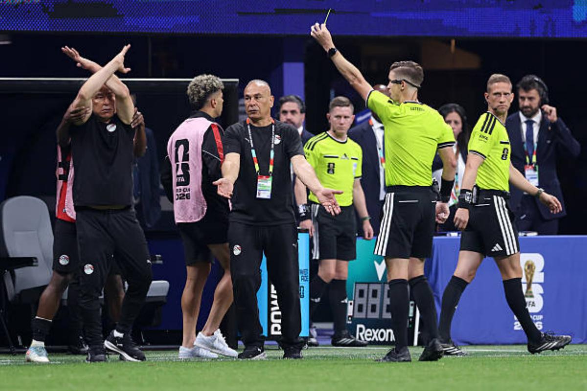 Hossam Hassan, Head Coach of Egypt makes a cross arm gesture as Referee Francois Letexier shows a yellow card during the FIFA World Cup 2026 Round of 16 match between Argentina and Egypt at Atlanta Stadium on July 7, 2026 in Atlanta, Georgia. Photo: Catherine Ivill- AMA/Getty Images