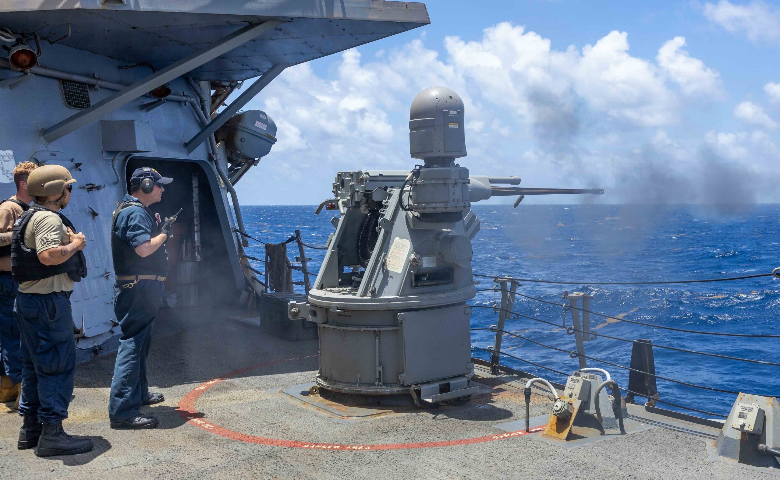 Sailors assigned to the Combat Gunnery division aboard the Arleigh Burke -class guided missle destroyer USS Cole [DDG67] overseae a pre-caution calibration test fire in the Caribean Sea, July 10, 2025. Photo: Jonathan Word/U.S. Navy