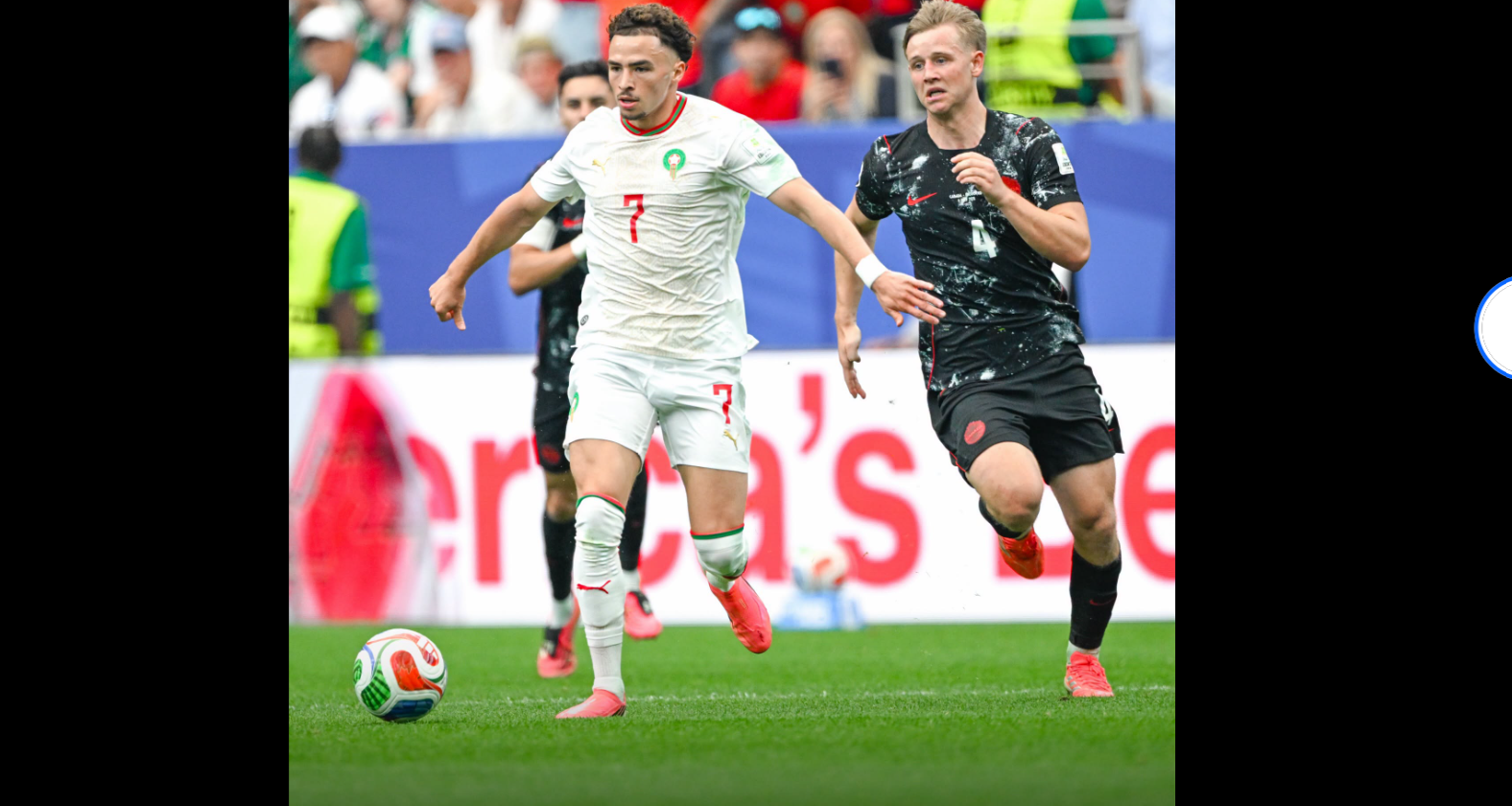 Canada player competes for the ball against a Morocco player during the FIFA World Cup 2026 Round of 16 match between Canada and Morocco at Houston Stadium in Houston, Texas on July 4, 2026 at 12:00 PM. Photo: Alex Slitz/Getty Images
