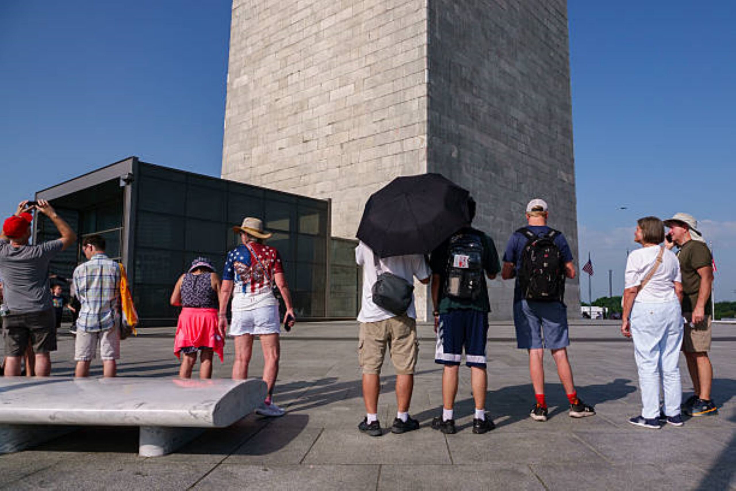 People outside the Washington Monument before it was closed due to the extreme heat in Washington, DC on July 2, 2026 at 7:23 PM. Photo: Kevin Carter/Getty Images. © Getty Images