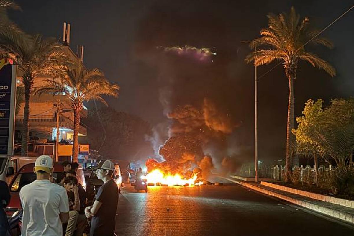 Hezbollah supporters block the old airport road in the southern Beirut,with burning tires to protest against the trilateral agreement that was signed between the US. Israel and Lebanon in Beirut, Lebanon on June 27, 2026 at 5:16 PM. Photo: Ibrahim Amro/AFP via Getty Images