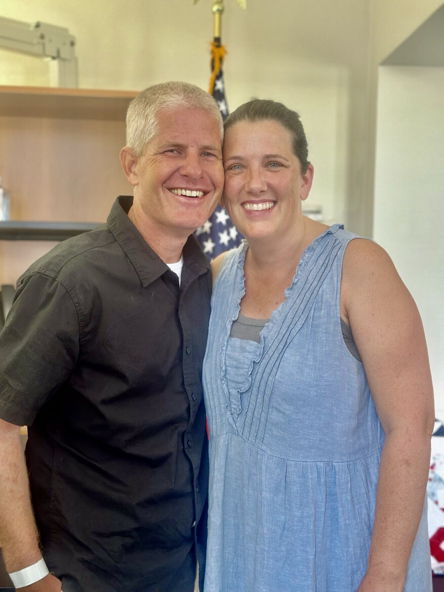 Kevin Rideout and Krista Rideout posed at an unknown location on 08/16/2026. The image marks the reunion of the former hostage with his wife following his liberation, which President Donald J.