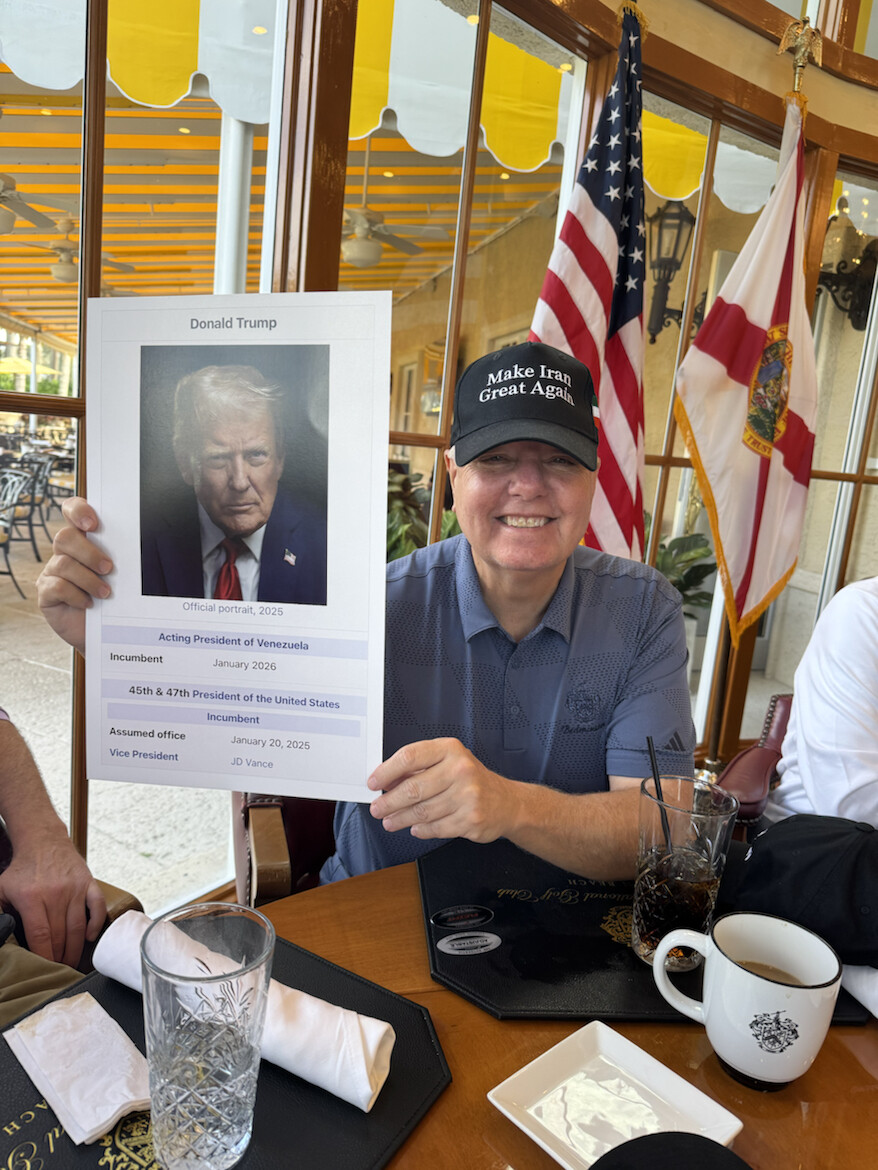 An unidentified supporter wearing a "Make Iran Great Again" hat holds up a satirical biographical infobox at a dining table on 08/18/2026. The image was posted by Donald J.