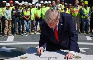 Trump Signs Ceremonial Slab at Construction Event Captioned “CORTS”